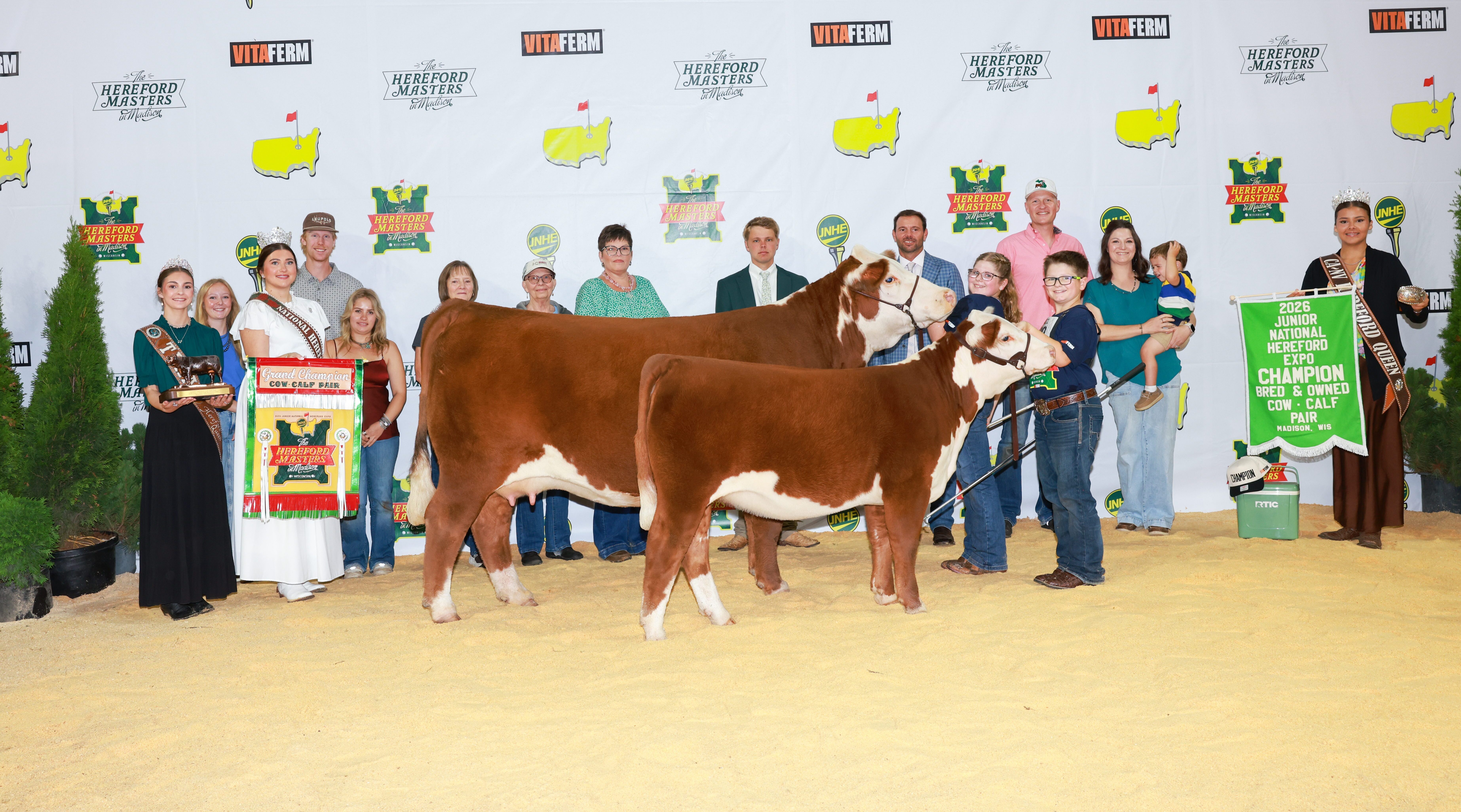 Kaytlyn and Easton Harfst with grand champion Hereford cow-calf pair Eden and Fern at JNHE